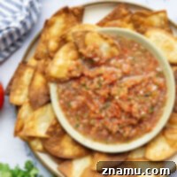 Vibrant Tomato Salsa 8 Loaded with lots of juicy summer tomatoes and a mild kick of heat, this tomato salsa is incredible with crispy tortilla chips and blends up in less than 10 minutes in your food processor!
