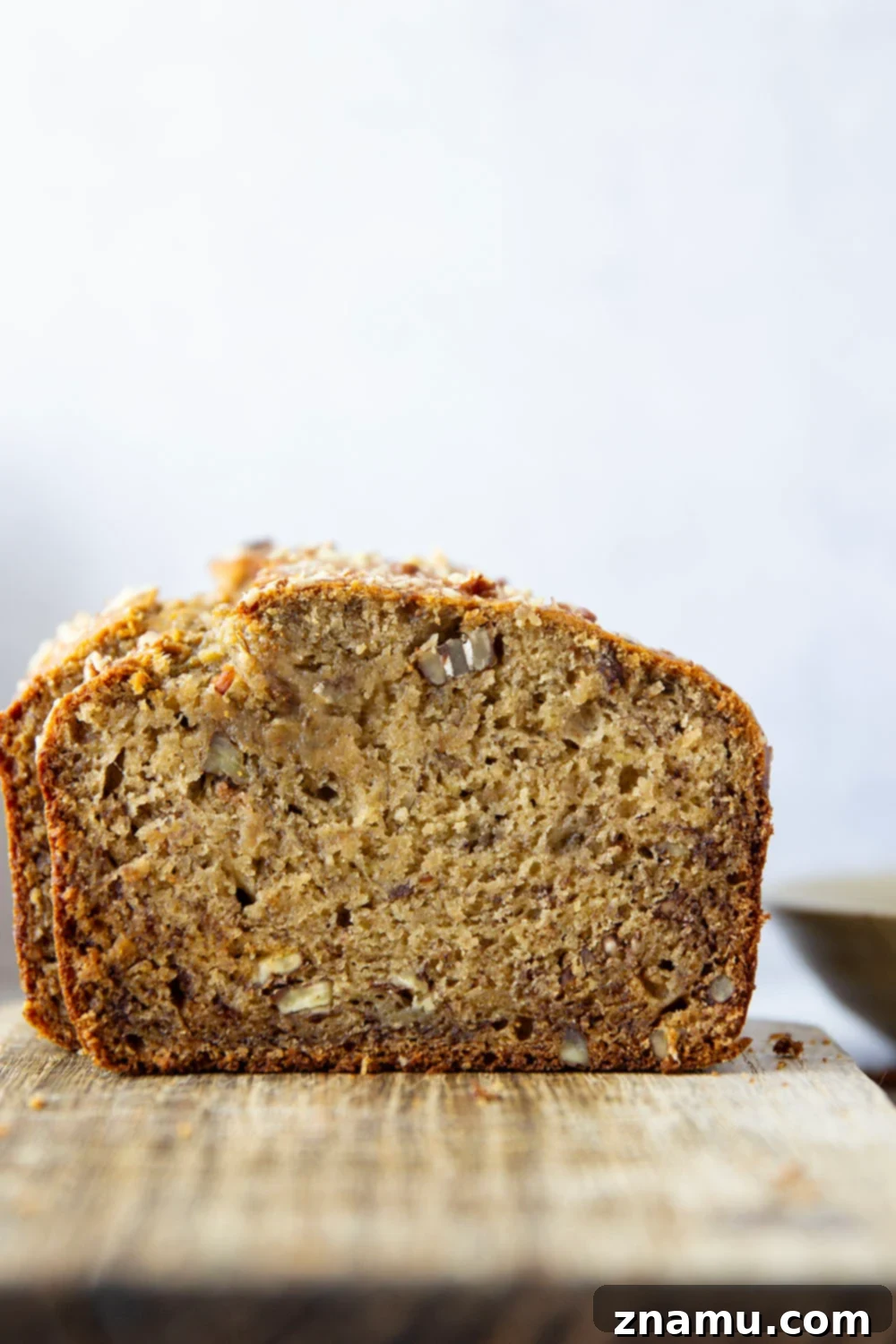 The Ultimate Banana Bread 2 The ultimate moist pecan banana bread recipe, served warm with butter.