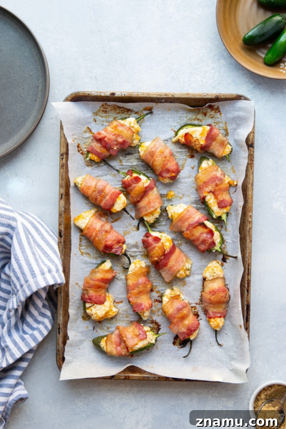 Crispy Bacon & Cream Cheese Jalapeño Bites 3 Wrapped in crispy brown sugar bacon and filled with a rich cheddar cream cheese filling, these bacon wrapped jalapeno poppers are the ultimate sweet and savory appetizer!