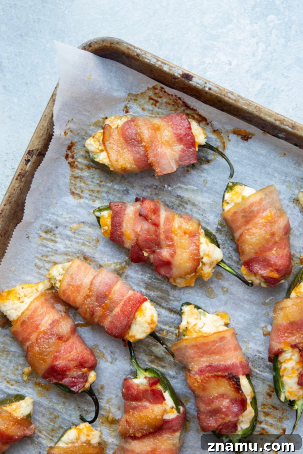 Crispy Bacon & Cream Cheese Jalapeño Bites 4 Wrapped in crispy brown sugar bacon and filled with a rich cheddar cream cheese filling, these bacon wrapped jalapeno poppers are the ultimate sweet and savory appetizer!