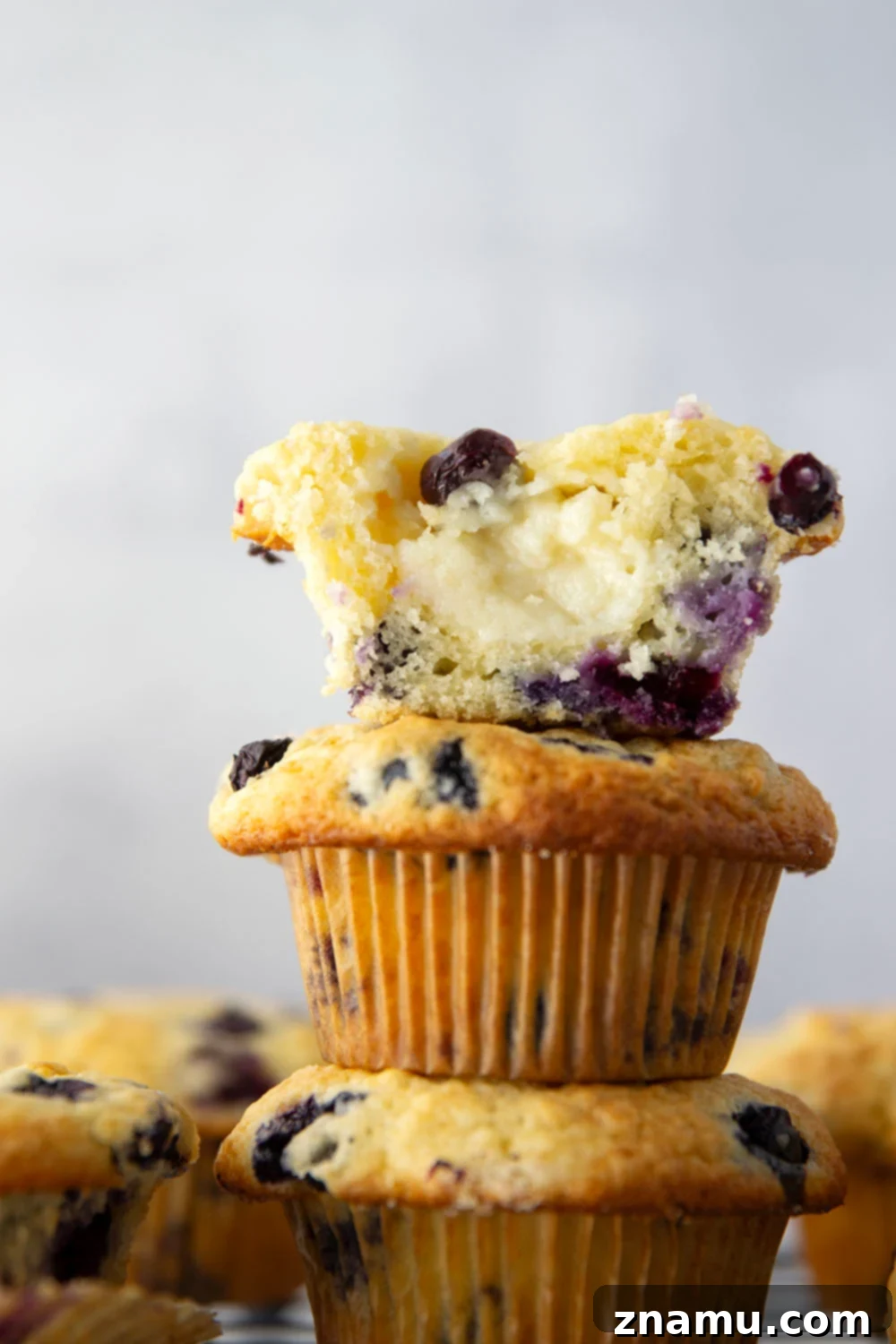 Blueberry Muffins with Cream Cheese Swirl 2 Super soft and moist blueberry cream cheese muffins with a rich cheesecake center and lots of juicy blueberries in every bite.