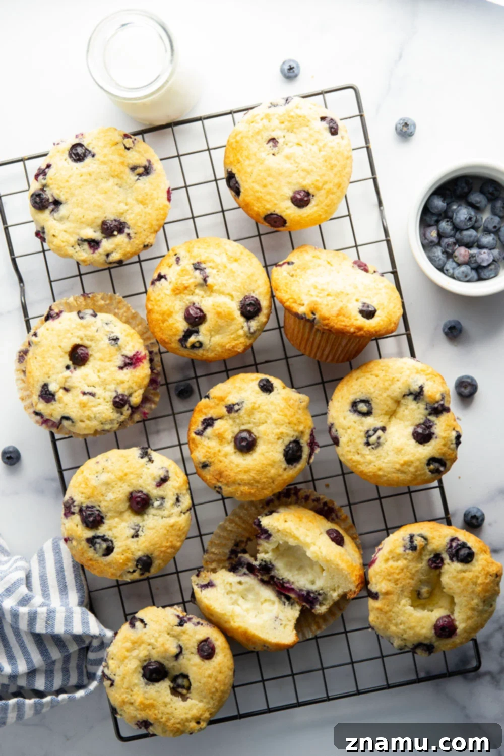 Blueberry Muffins with Cream Cheese Swirl 3 Super soft and moist blueberry cream cheese muffins with a rich cheesecake center and lots of juicy blueberries in every bite.