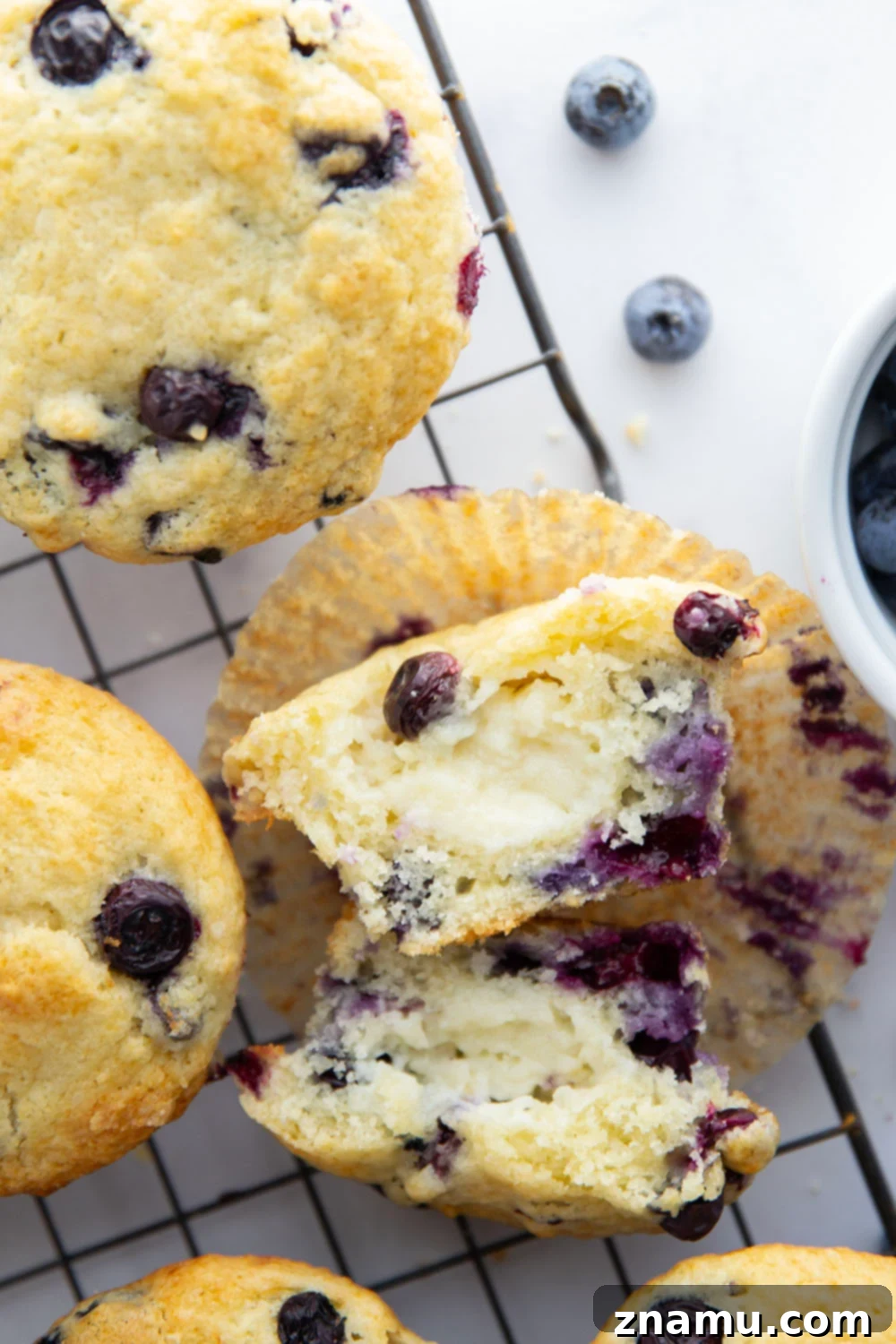 Blueberry Muffins with Cream Cheese Swirl 4 Super soft and moist blueberry cream cheese muffins with a rich cheesecake center and lots of juicy blueberries in every bite.