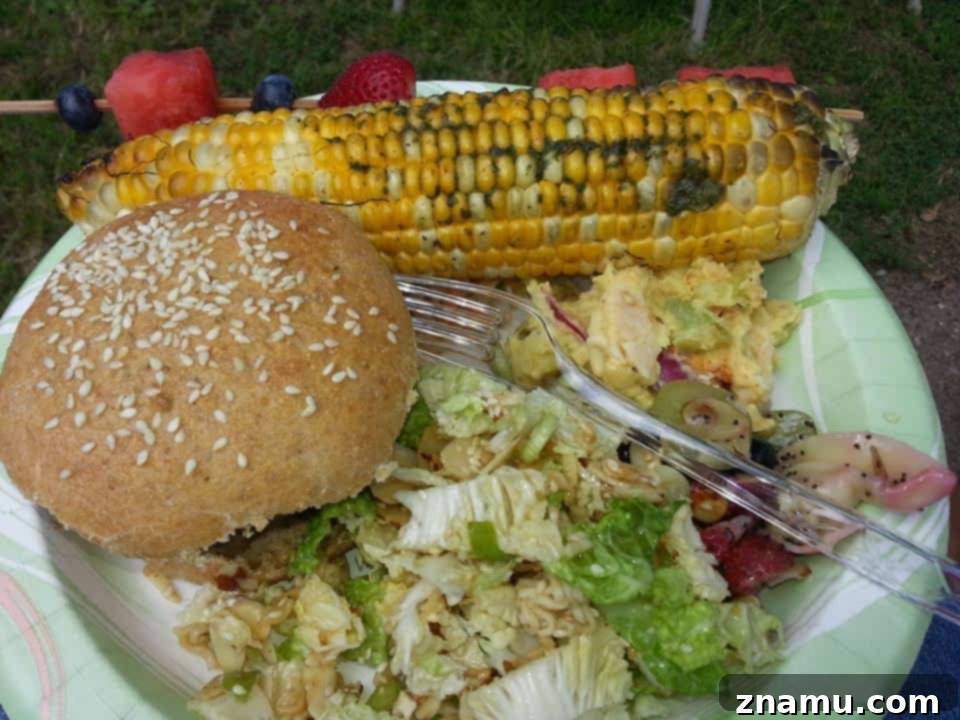 Reliving Summer 2014 14 A bountiful spread of food laid out for a 4th of July cook-out, with various dishes visible.