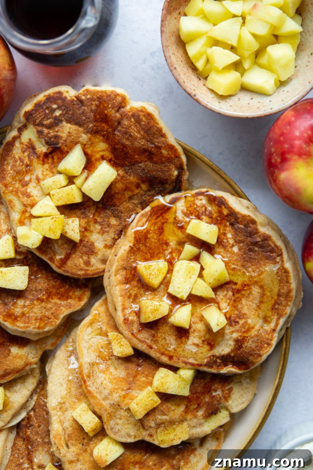 Fluffy Apple Ricotta Pancakes 4 These apple ricotta pancakes are the ultimate fall breakfast! Ricotta cheese gives them an incredible light and fluffy texture while sautéed apples and lots of spices give them the perfect touch of fall.