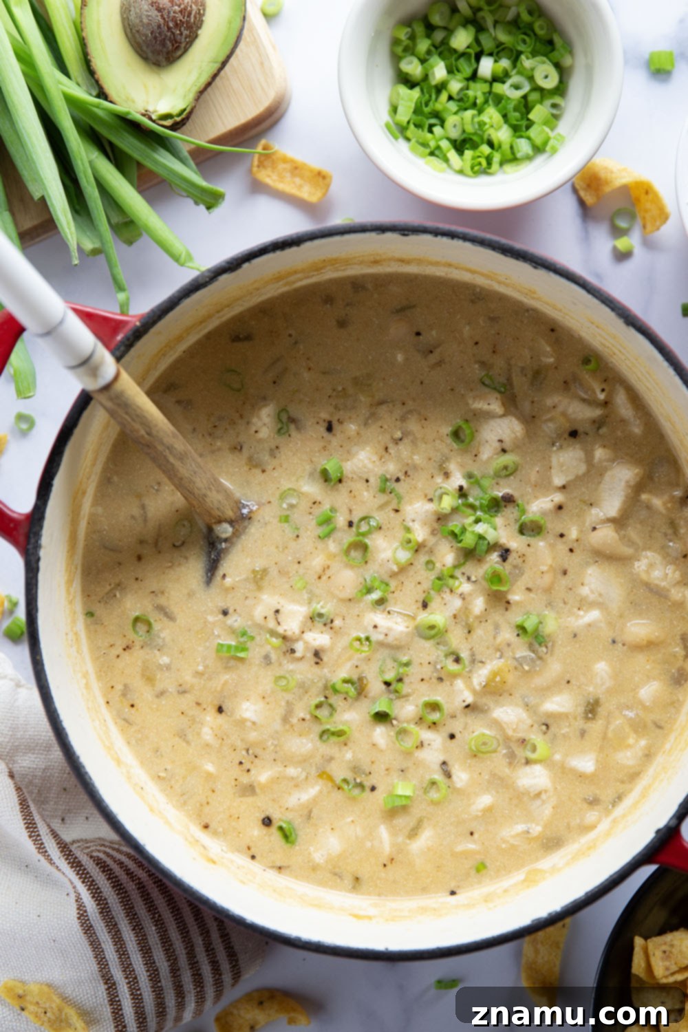 Ultimate White Chicken Chili 5 Cubed chicken breasts being sautéed in a pot, a crucial step for developing flavor in white chicken chili.