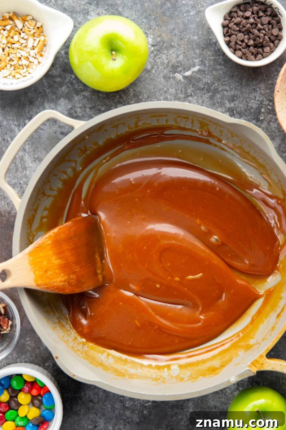Gourmet Hand-Dipped Caramel Apples 3 Dipped in a rich homemade caramel sauce and coated in a variety of fun toppings, these homemade caramel apples truly are the deluxe version of a fall classic!