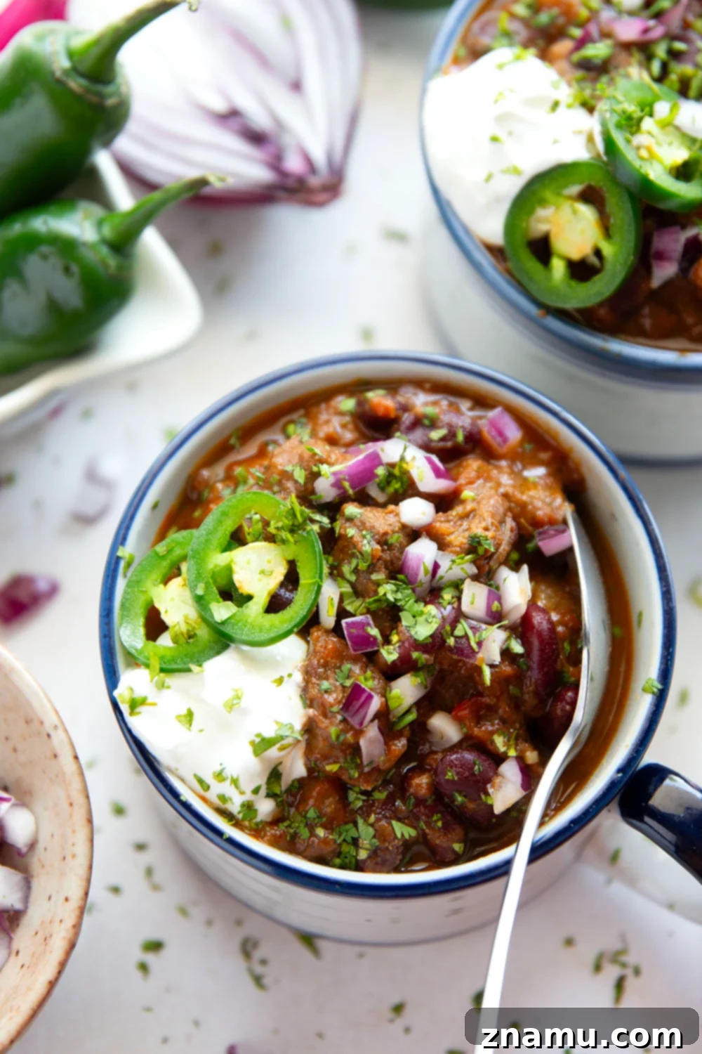 Fiery Steak Chili 4 Thick and chunky steak chili features fall-apart tender steak cubes, lots of hearty beans, and the perfect amount of zippy heat from jalapenos.