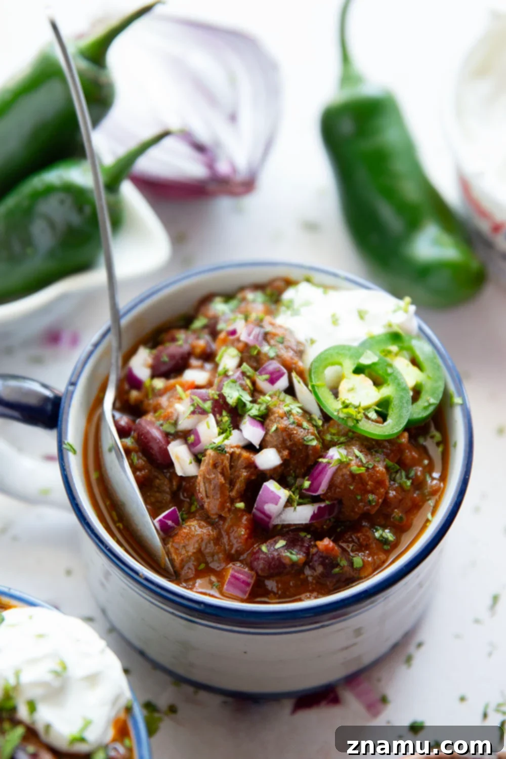 Fiery Steak Chili 6 Thick and chunky steak chili features fall-apart tender steak cubes, lots of hearty beans, and the perfect amount of zippy heat from jalapenos.
