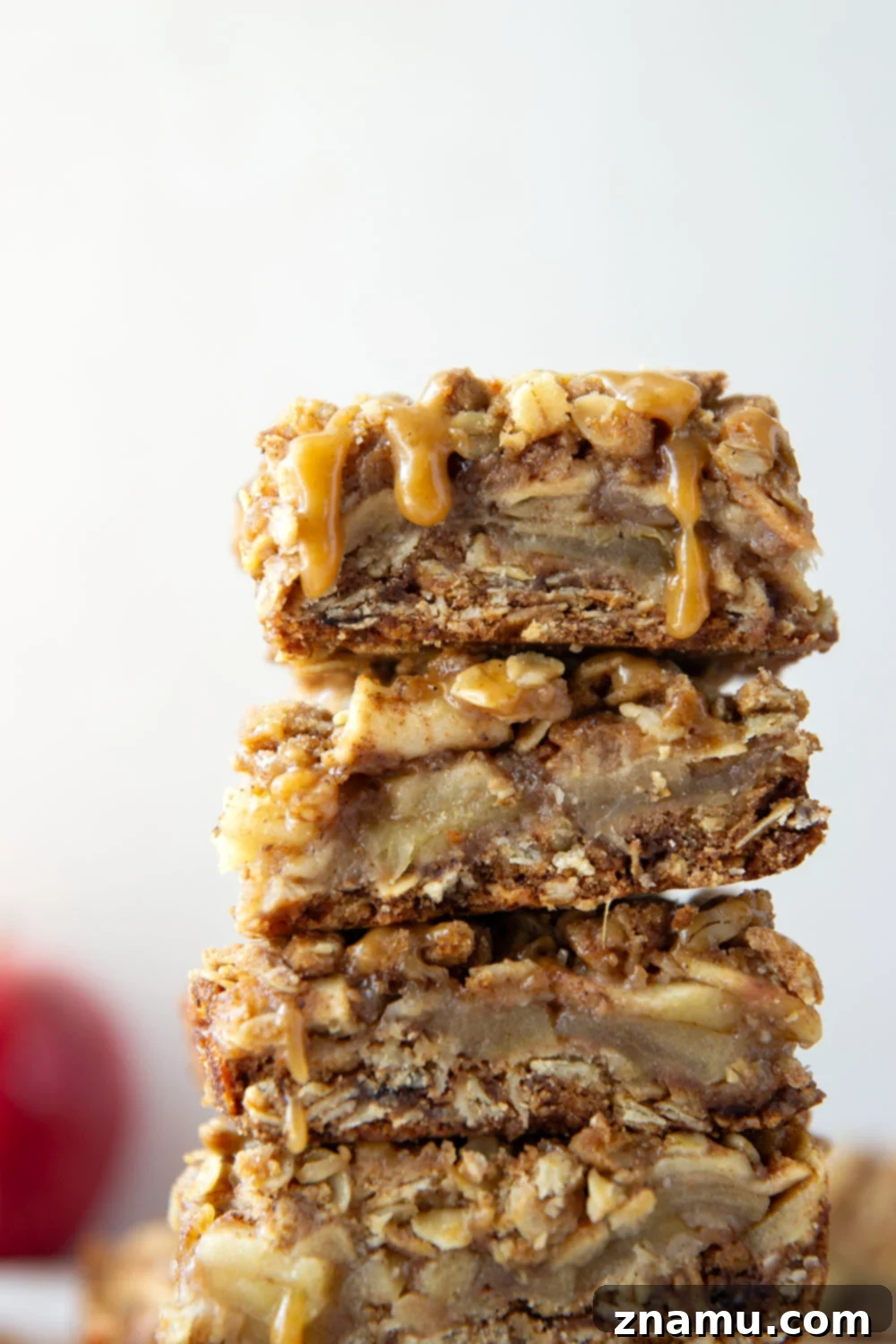 Autumn Apple Crumble Bars 2 Delicious Apple Crisp Bars with a golden streusel topping and caramel drizzle, perfect for a cozy fall treat.