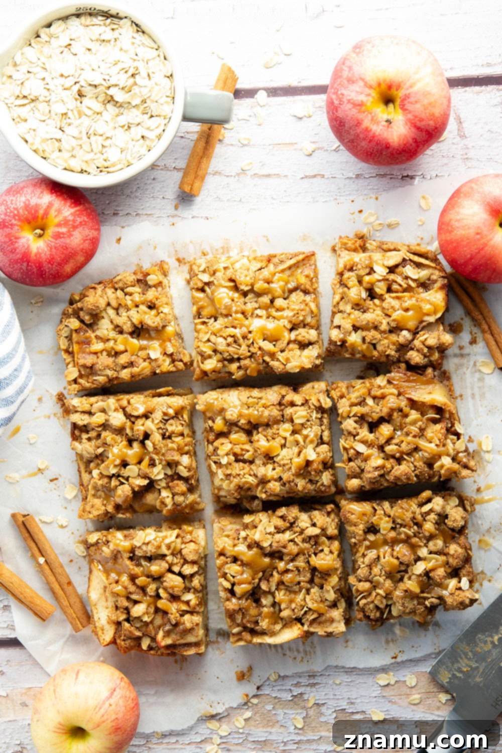 Autumn Apple Crumble Bars 4 Side view of Apple Crisp Bars, showing the distinct layers of oatmeal crust, apple filling, and streusel.