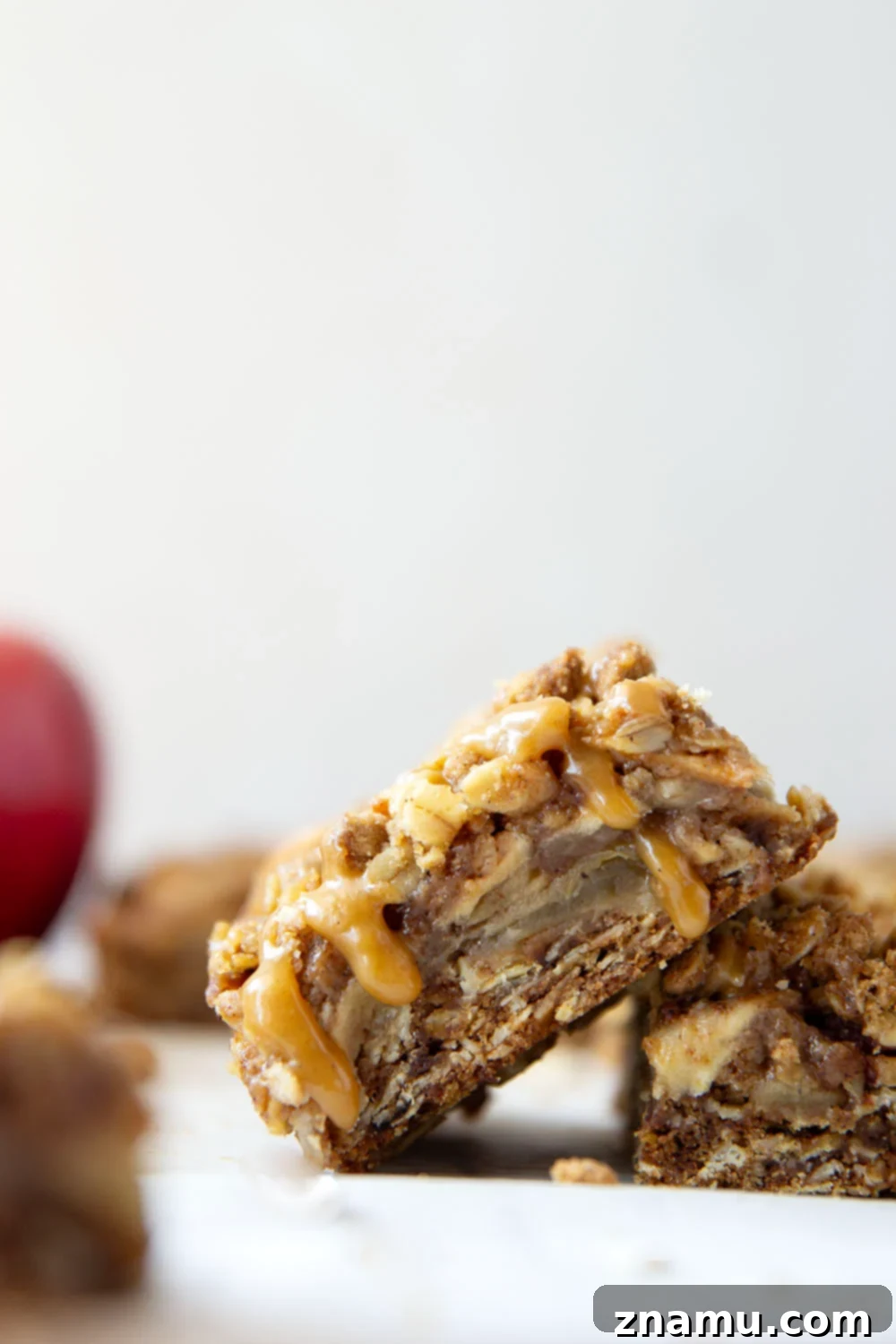 Autumn Apple Crumble Bars 6 A batch of freshly baked Apple Crisp Bars, cut into squares, ready to be enjoyed.