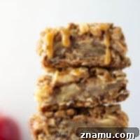 Delicious Apple Crisp Bars with a golden streusel topping and caramel drizzle.