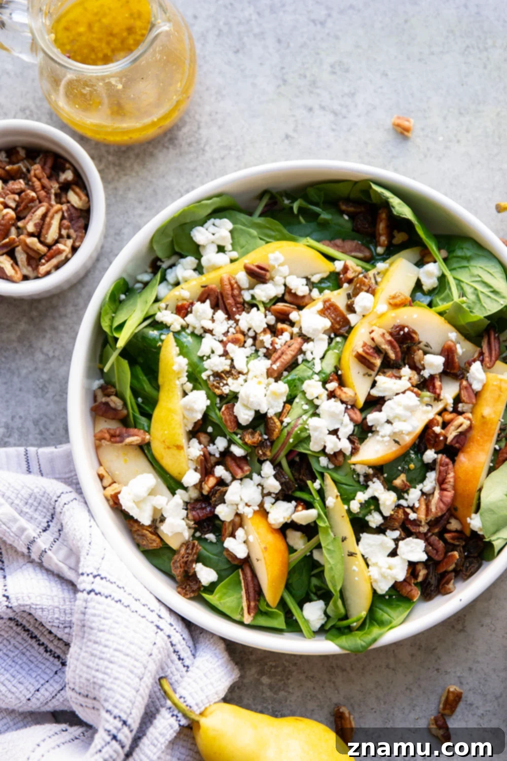 Sweet Pear and Creamy Goat Cheese Salad 2 Loaded with sweet pear slices, tangy goat cheese, and lots of toasted pecans, this pear goat cheese salad is the perfect fall salad!