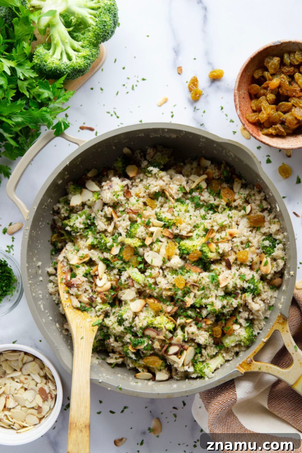 Flavorful Cauliflower Rice Pilaf 5 Raw riced cauliflower showing its grain-like texture, meticulously prepared and ready for cooking, a perfect low-carb rice alternative.