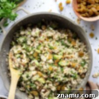 Classic Cauliflower Rice Pilaf with broccoli, almonds, and golden raisins