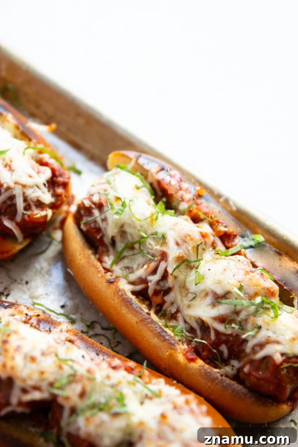 Mouthwatering Italian Meatball Subs 2 Juicy meatballs are simmered in flavorful marinara sauce and baked with two kinds of cheese on top in these easy Italian meatball subs!
