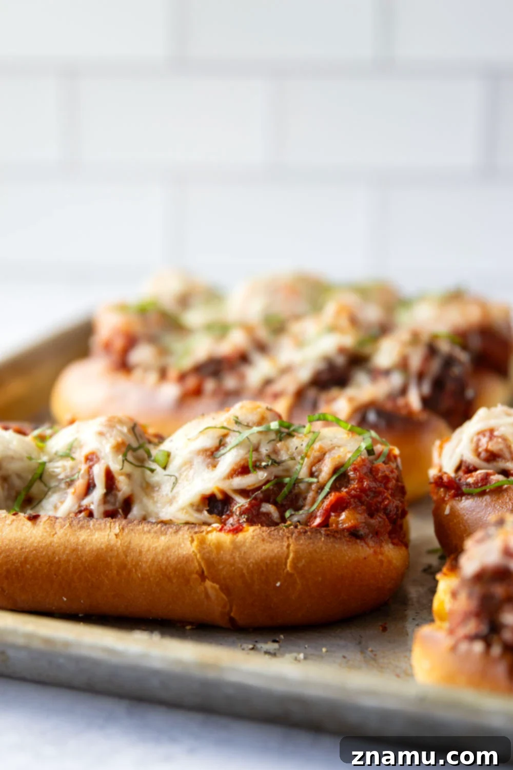 Mouthwatering Italian Meatball Subs 5 Juicy meatballs are simmered in flavorful marinara sauce and baked with two kinds of cheese on top in these easy Italian meatball subs!