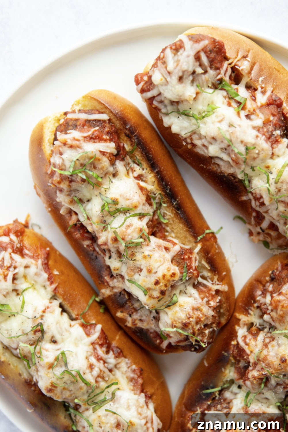 Mouthwatering Italian Meatball Subs 6 Juicy meatballs are simmered in flavorful marinara sauce and baked with two kinds of cheese on top in these easy Italian meatball subs!