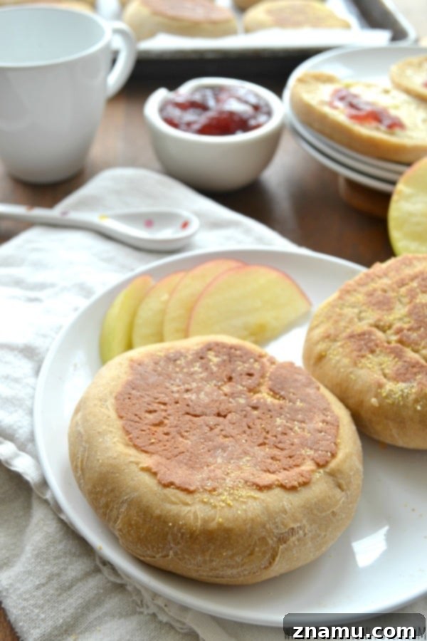 Perfect Homemade English Muffins 4 Sliced homemade English muffins toasted with butter and jam, showing delicious texture
