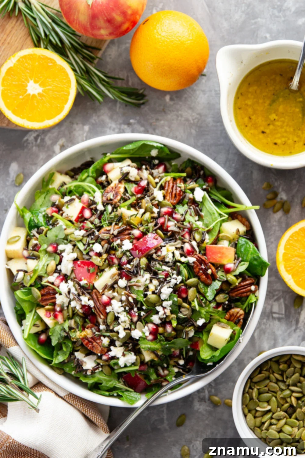 Vibrant Harvest Wild Rice Salad with crisp apples, toasted pecans, and a maple orange dressing