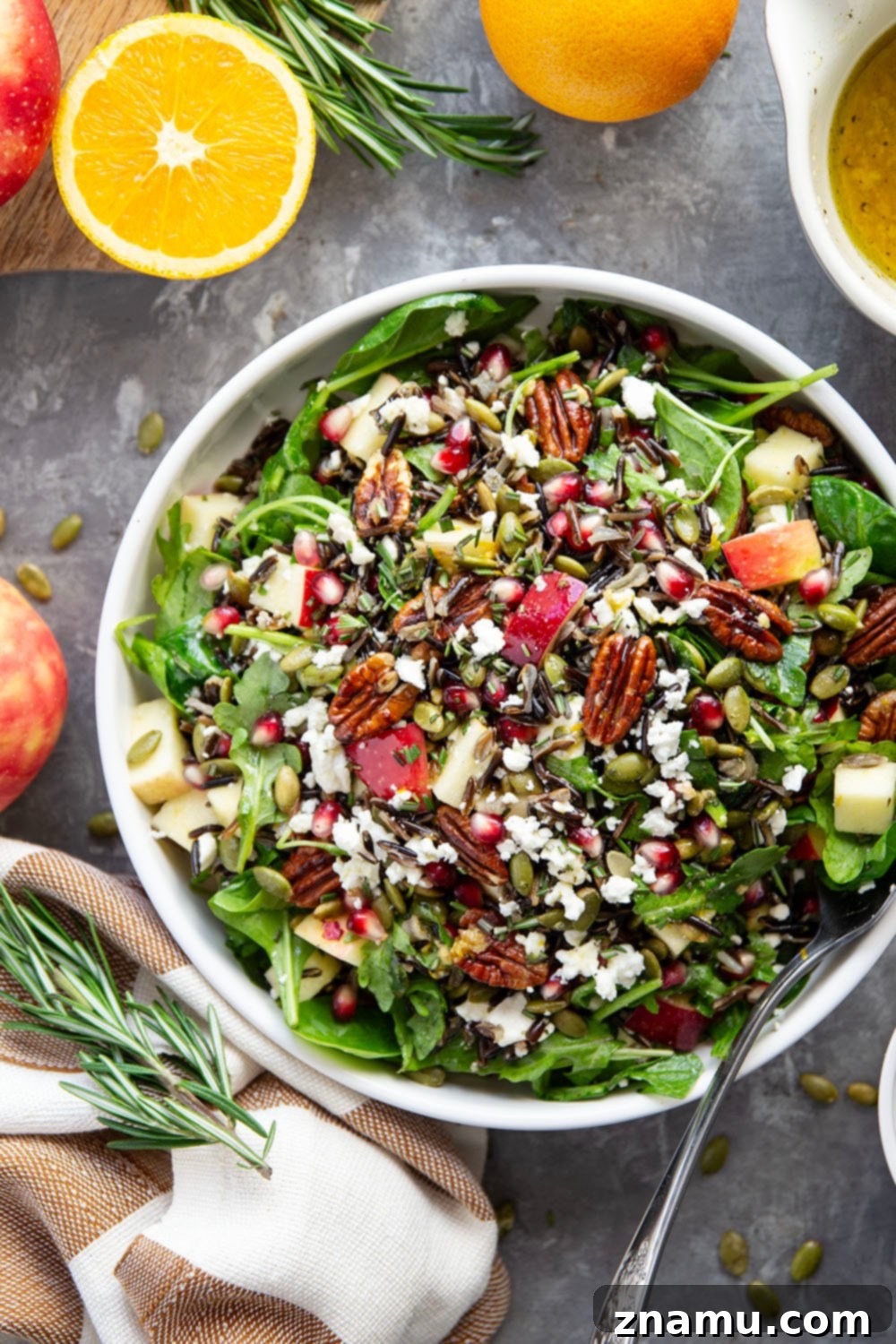 Serving of Harvest Wild Rice Salad in a bowl, showing texture and colorful ingredients