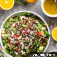 Packed with all kinds of fall goodness and tossed in a maple orange dressing, this harvest wild rice salad is the perfect fall side dish for any occasion!