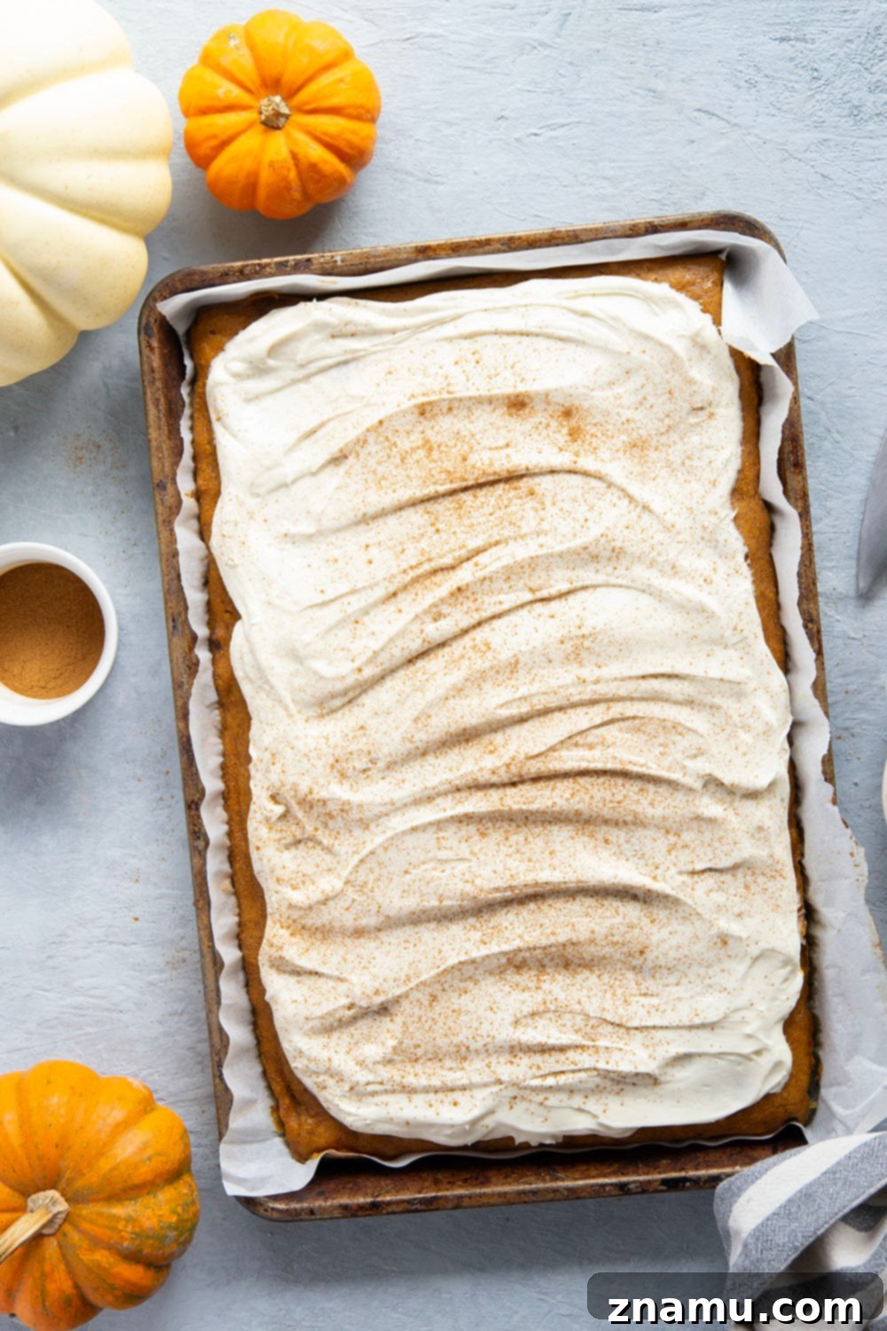 Spiced Pumpkin Sheet Cake 4 Creamy pumpkin and plenty of fall spices shine through in this super soft pumpkin sheet cake that gets frosted in a silky cream cheese frosting and is big enough to serve a crowd.