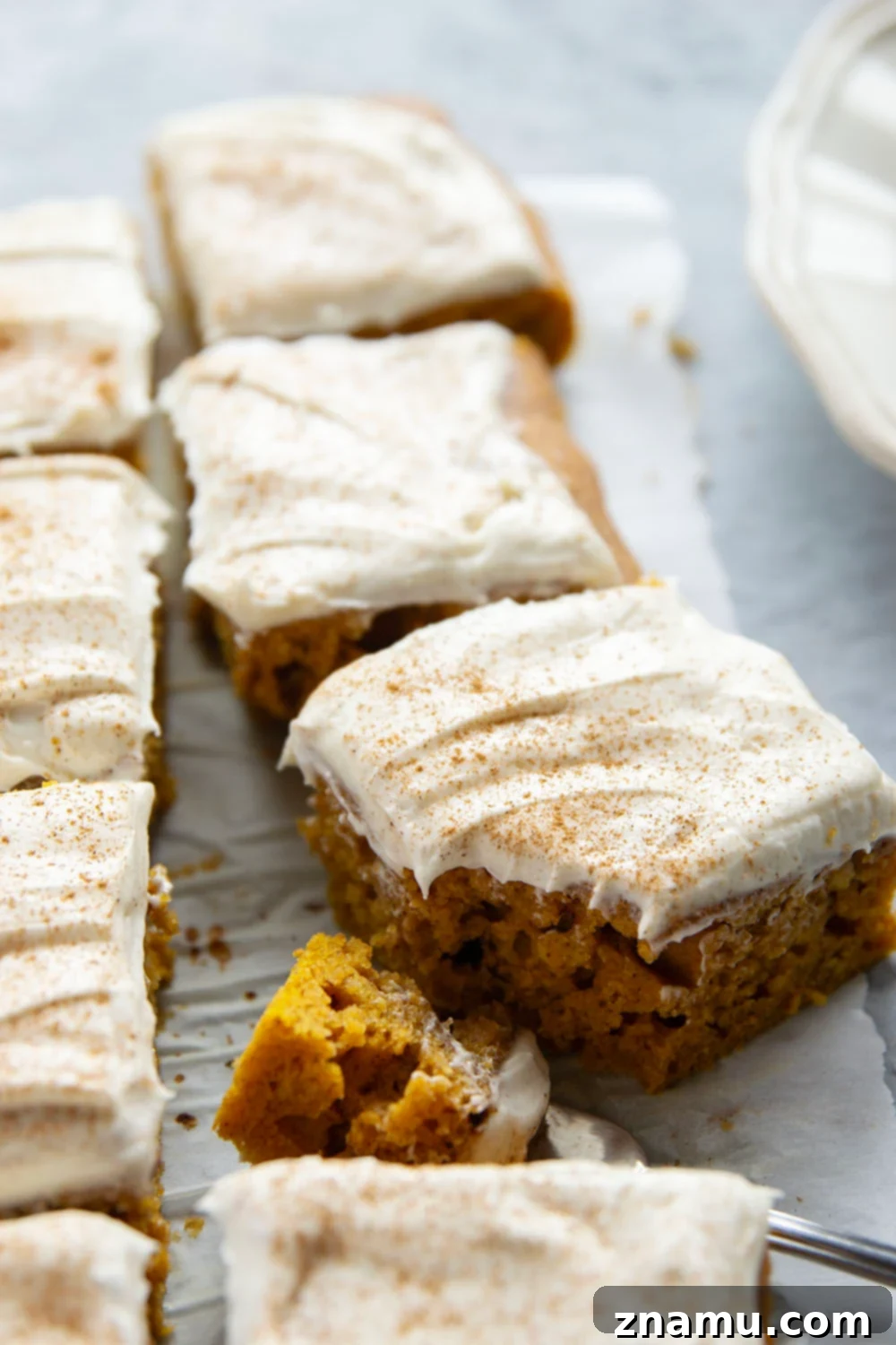 Spiced Pumpkin Sheet Cake 6 Creamy pumpkin and plenty of fall spices shine through in this super soft pumpkin sheet cake that gets frosted in a silky cream cheese frosting and is big enough to serve a crowd.