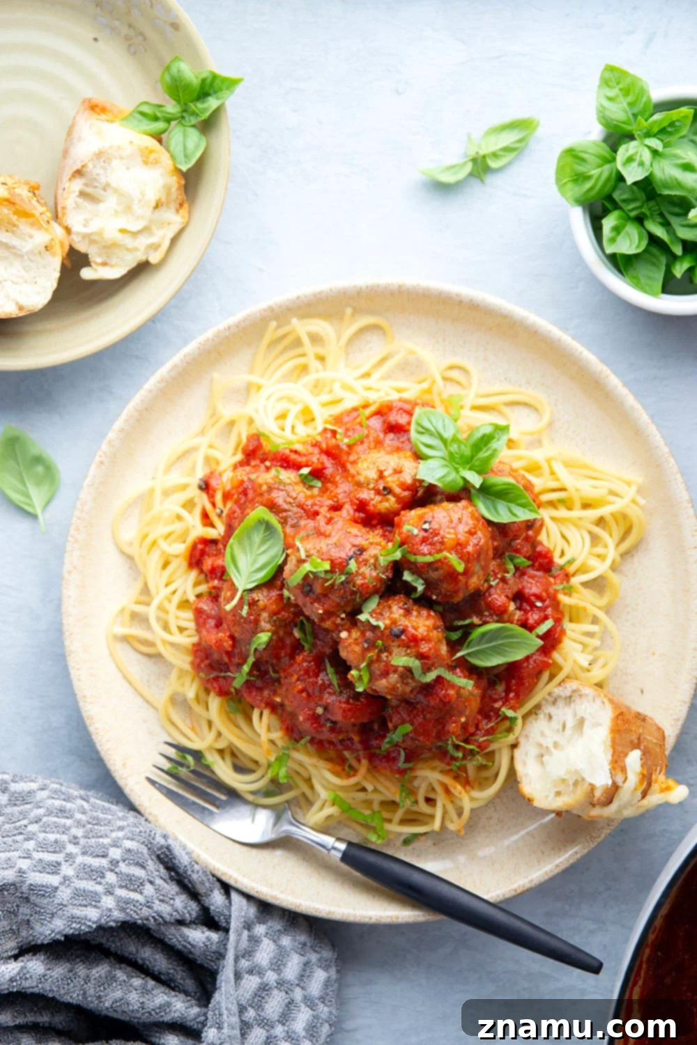 Simply Delicious Spaghetti and Meatballs 3 Close-up of easy spaghetti and meatballs with homemade sauce and fresh basil