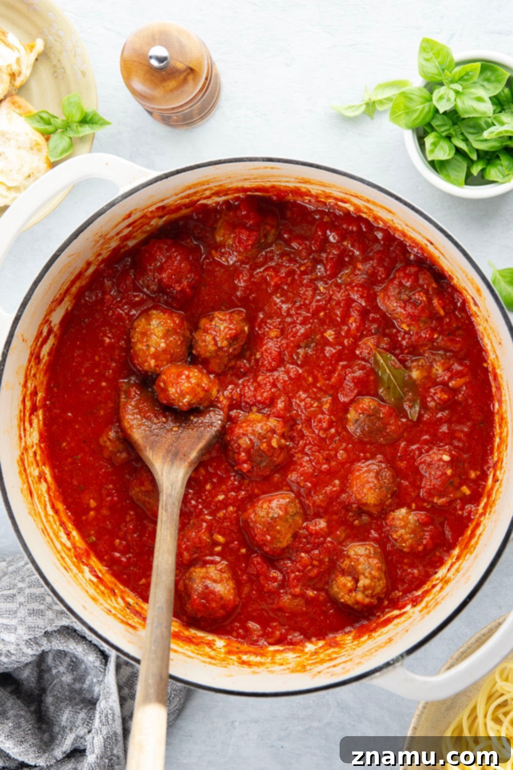 Simply Delicious Spaghetti and Meatballs 5 Uncooked meatballs on a plate, ready for searing