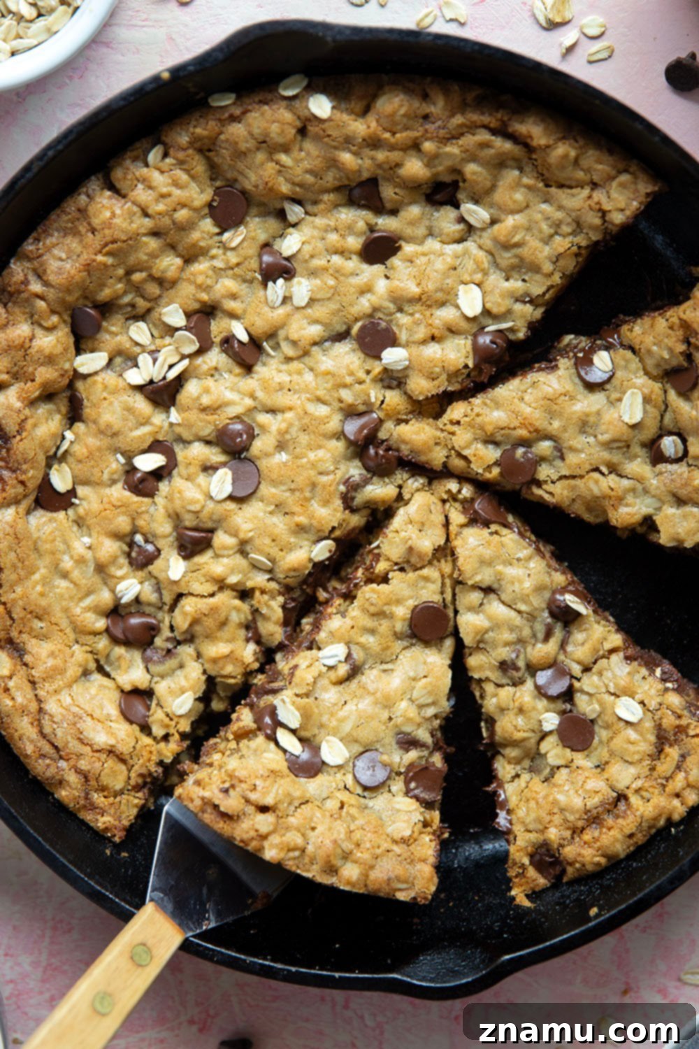 Warm Skillet Chocolate Oat Treat 4 A close-up of the textured interior of the oatmeal skillet cookie, highlighting the oats and melted chocolate chips.