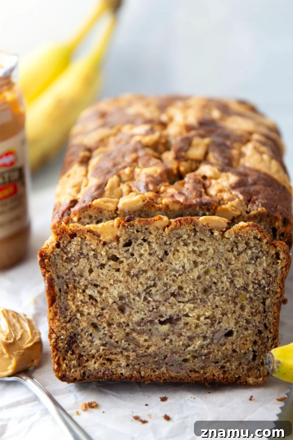 Nutty Banana Bread Bliss 2 Super-soft peanut butter banana bread with luscious swirls of creamy peanut butter and sweet, ripe bananas. A perfect homemade treat.