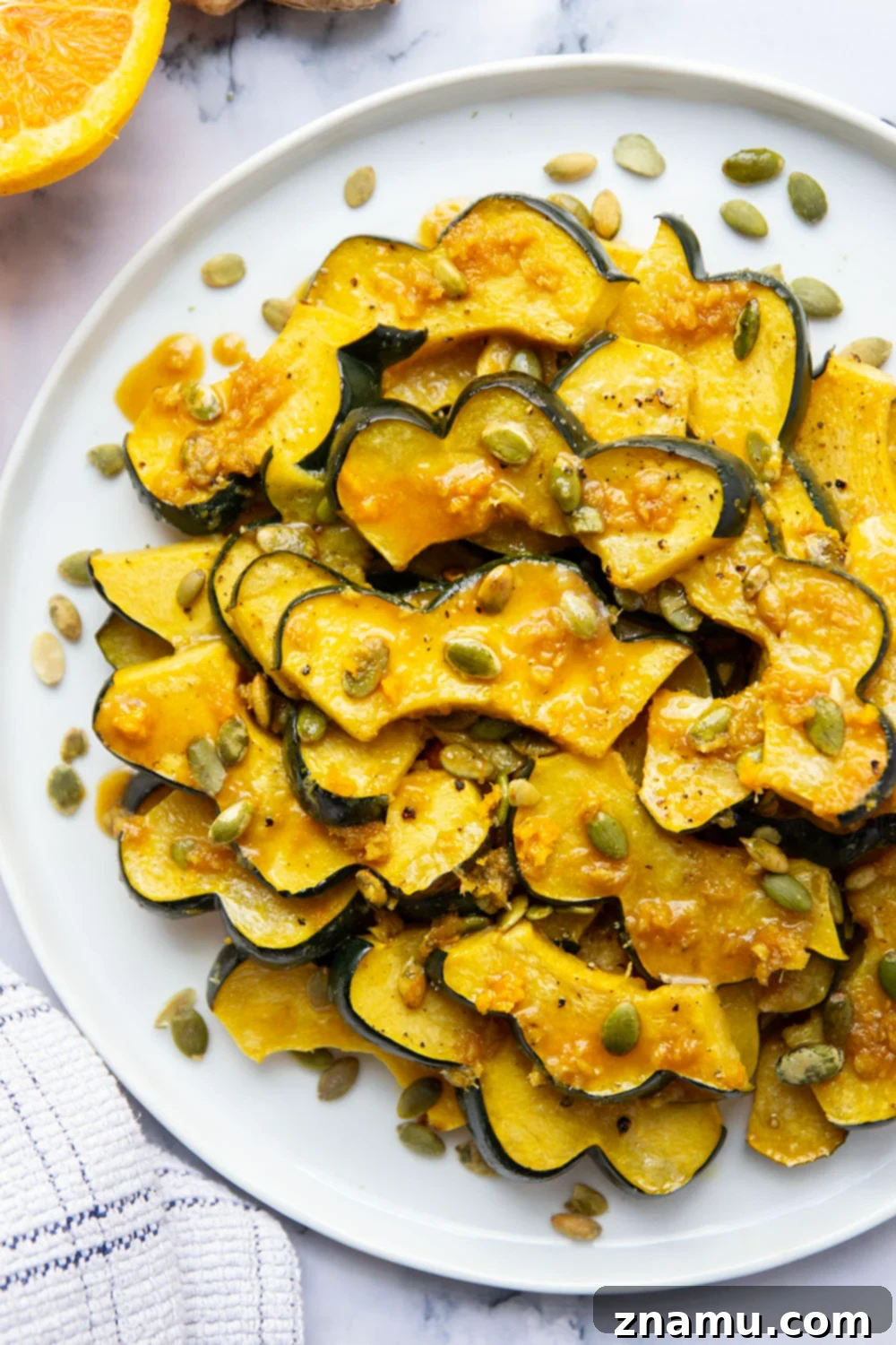 Sticky Ginger Orange Acorn Squash 2 Roasted until perfectly tender and drizzled with a flavorful fresh ginger orange glaze, this orange glazed acorn squash is the perfect fall side dish and so easy to pull together!
