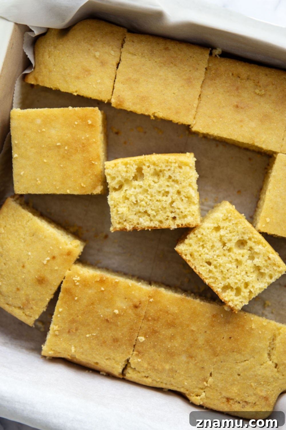 Golden Buttermilk Cornbread 4 A large pan of golden buttermilk cornbread, glistening with honey and butter.