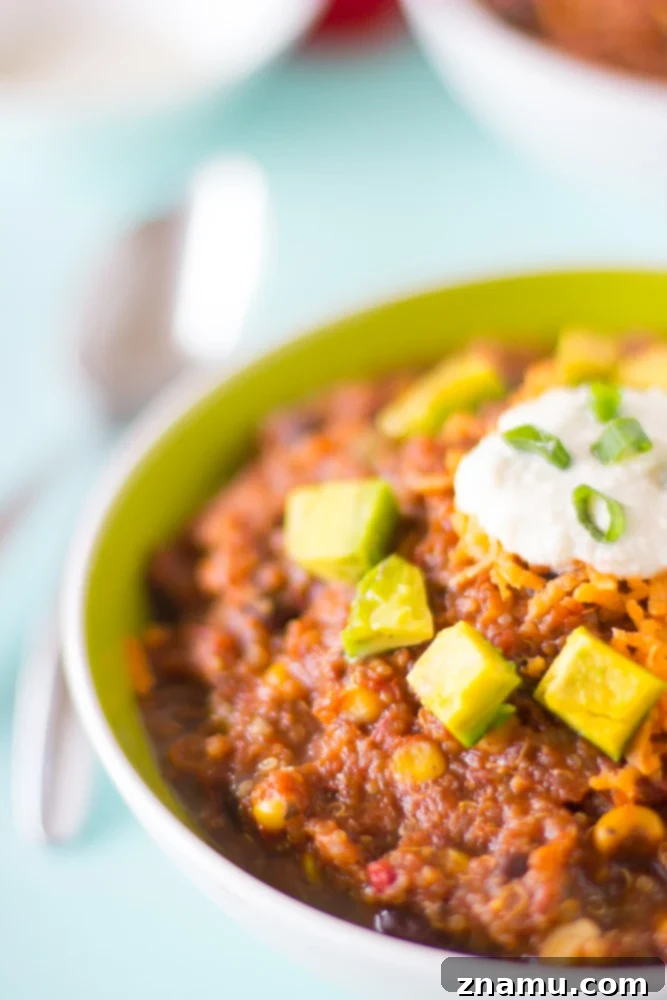 Plant-Powered Slow Cooker Quinoa and Black Bean Chili 2 Hearty Vegan Crockpot Quinoa and Black Bean Chili simmering in a slow cooker, a perfect healthy and plant-based meal for busy weeknights.