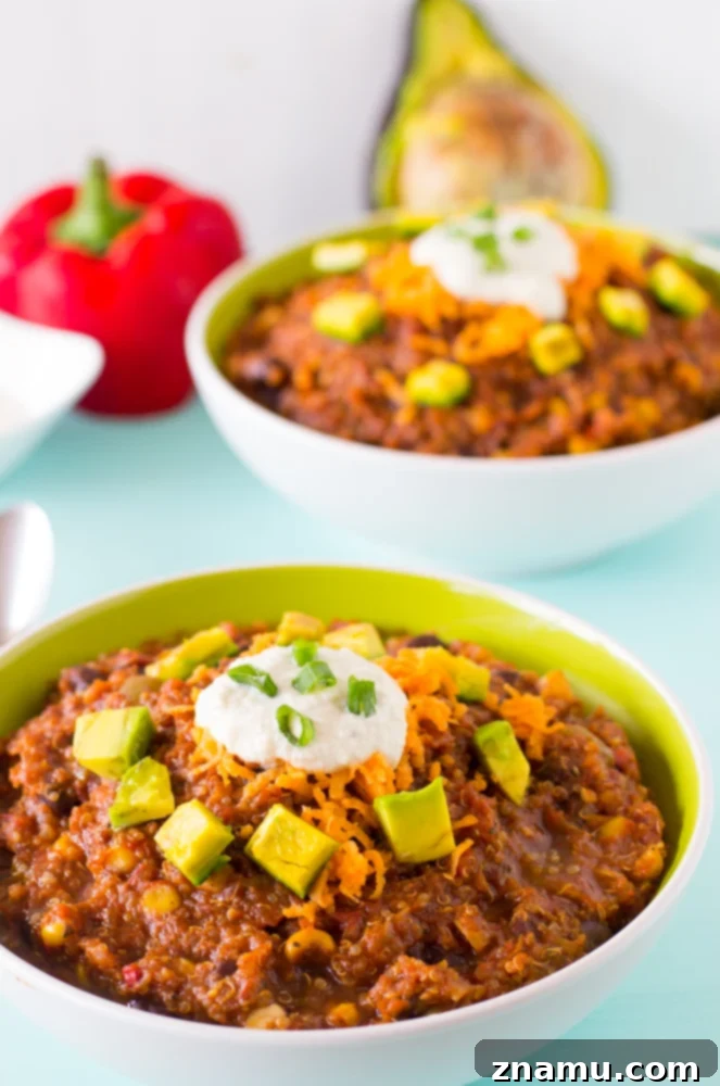 Plant-Powered Slow Cooker Quinoa and Black Bean Chili 4 A vibrant close-up of Vegan Crockpot Quinoa and Black Bean Chili, showcasing the colorful vegetables and rich chili texture, ready to be served.