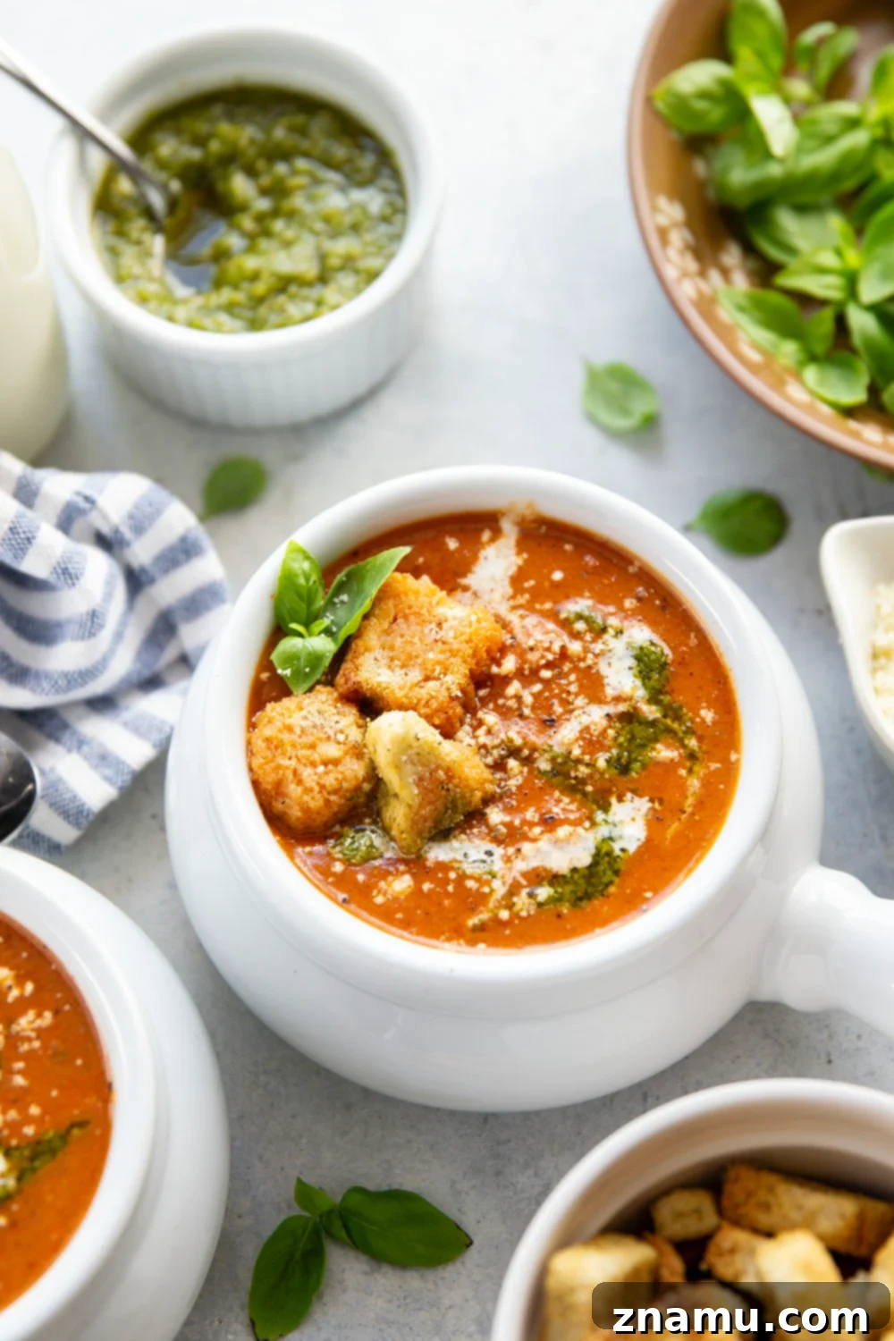 Vibrant Pesto Tomato Soup 4 Swirled with fresh basil pesto, this creamy pesto tomato soup is made completely from scratch and the ultimate grilled cheese sidekick!