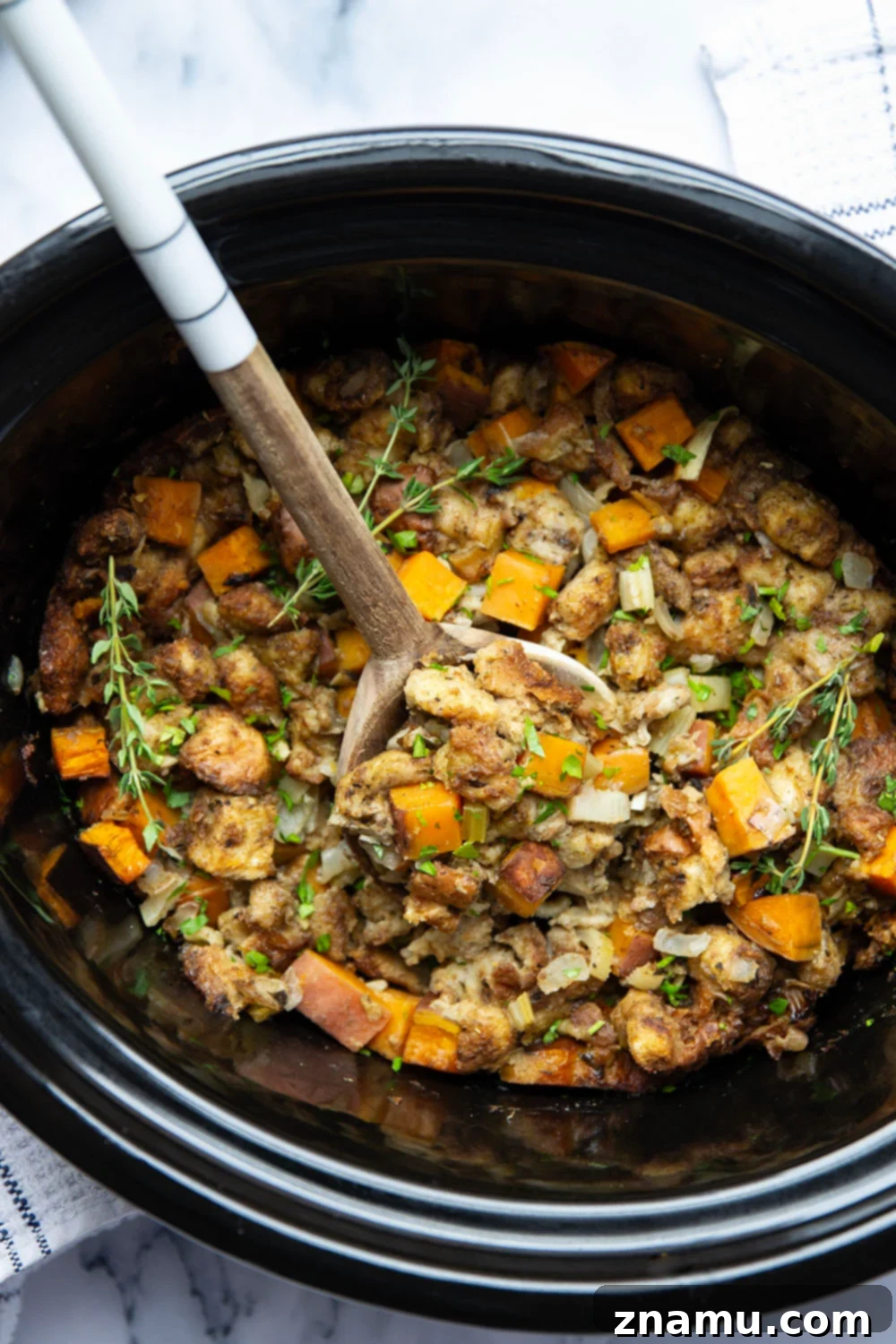 Autumn's Slow-Cooked Sweet Potato Stuffing 2 Tender sweet potato stuffing slow cooked to perfection for Thanksgiving.