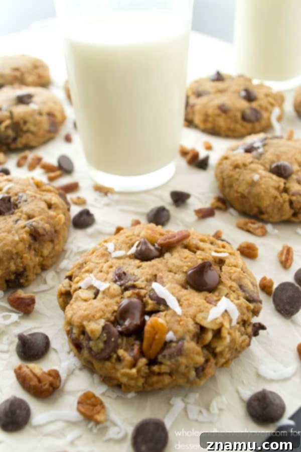 Ultimate Everything Cookies 5 Soft-Baked Kitchen Sink Cookie broken in half, showing gooey interior