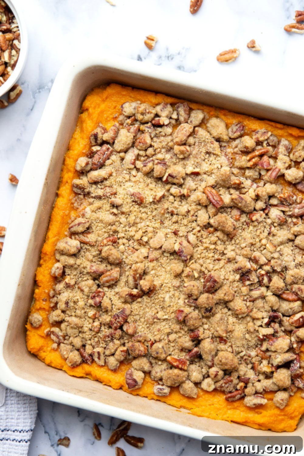 Velvety Sweet Potato Bake with Crunchy Pecan Topping 4 Freshly baked sweet potato casserole ready to serve, highlighting the crisp pecan streusel.