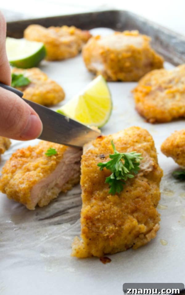 Golden Crispy Oven Chicken Tenders 8 Oven-fried crispy chicken tenders served beautifully with pasta, creating a wholesome meal.