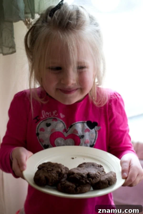 Three Delicious Homemade Cookie Mix Recipes 5 A close-up of Rachel, happily enjoying a freshly baked cookie.