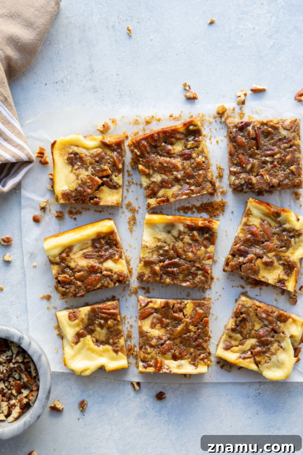 Honeyed Pecan Cheesecake Reverie 2 Silky cheesecake and a luxurious honey pecan pie topping are the perfect duo in these pecan pie cheesecake bars! They make a great addition to any holiday dessert table.