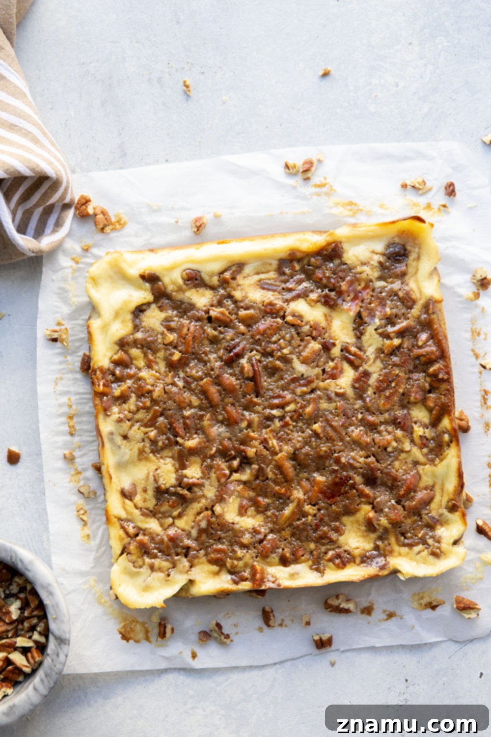 Honeyed Pecan Cheesecake Reverie 3 Silky cheesecake and a luxurious honey pecan pie topping are the perfect duo in these pecan pie cheesecake bars! They make a great addition to any holiday dessert table.