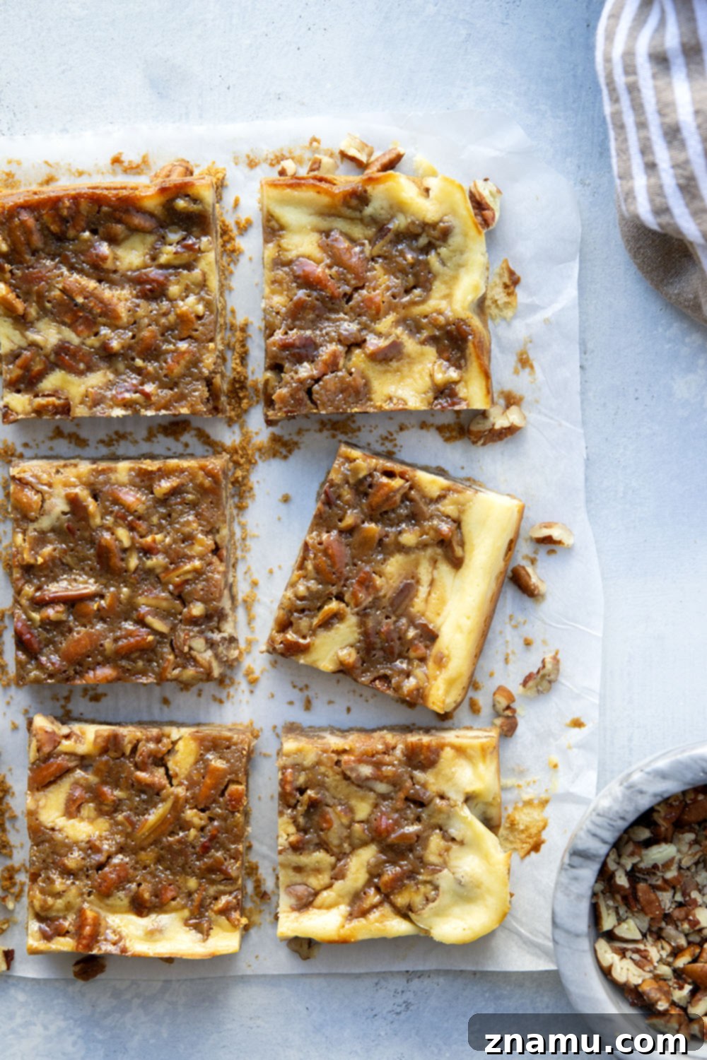 Honeyed Pecan Cheesecake Reverie 4 Silky cheesecake and a luxurious honey pecan pie topping are the perfect duo in these pecan pie cheesecake bars! They make a great addition to any holiday dessert table.