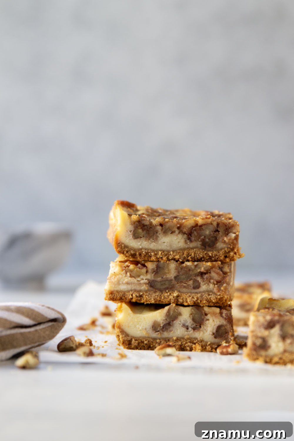 Honeyed Pecan Cheesecake Reverie 5 Silky cheesecake and a luxurious honey pecan pie topping are the perfect duo in these pecan pie cheesecake bars! They make a great addition to any holiday dessert table.
