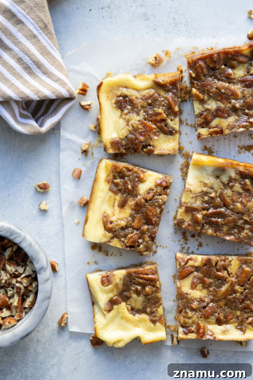 Honeyed Pecan Cheesecake Reverie 6 Silky cheesecake and a luxurious honey pecan pie topping are the perfect duo in these pecan pie cheesecake bars! They make a great addition to any holiday dessert table.