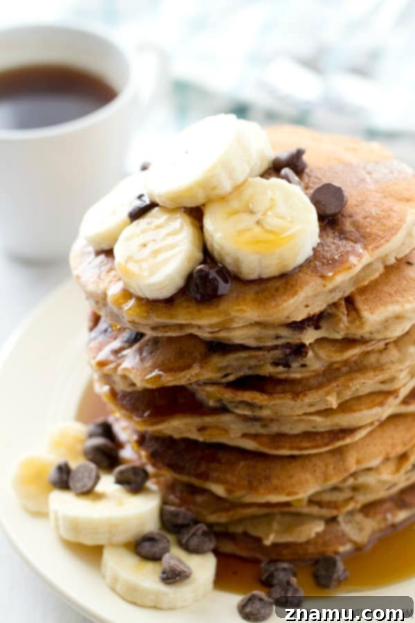 Hearty Banana Oatmeal Chocolate Chip Pancakes 4 A stack of golden brown banana oatmeal pancakes ready to be served
