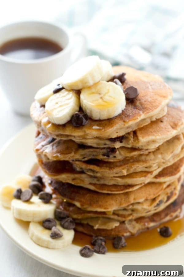 Hearty Banana Oatmeal Chocolate Chip Pancakes 6 Uncooked pancake batter with chocolate chips and banana pieces